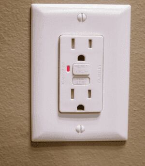 A Ground Fault Control Interpreter outlet installed in a wall